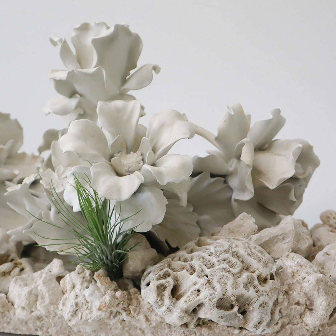 Keystone Sculpture with Porcelain Flowers Plant the Future